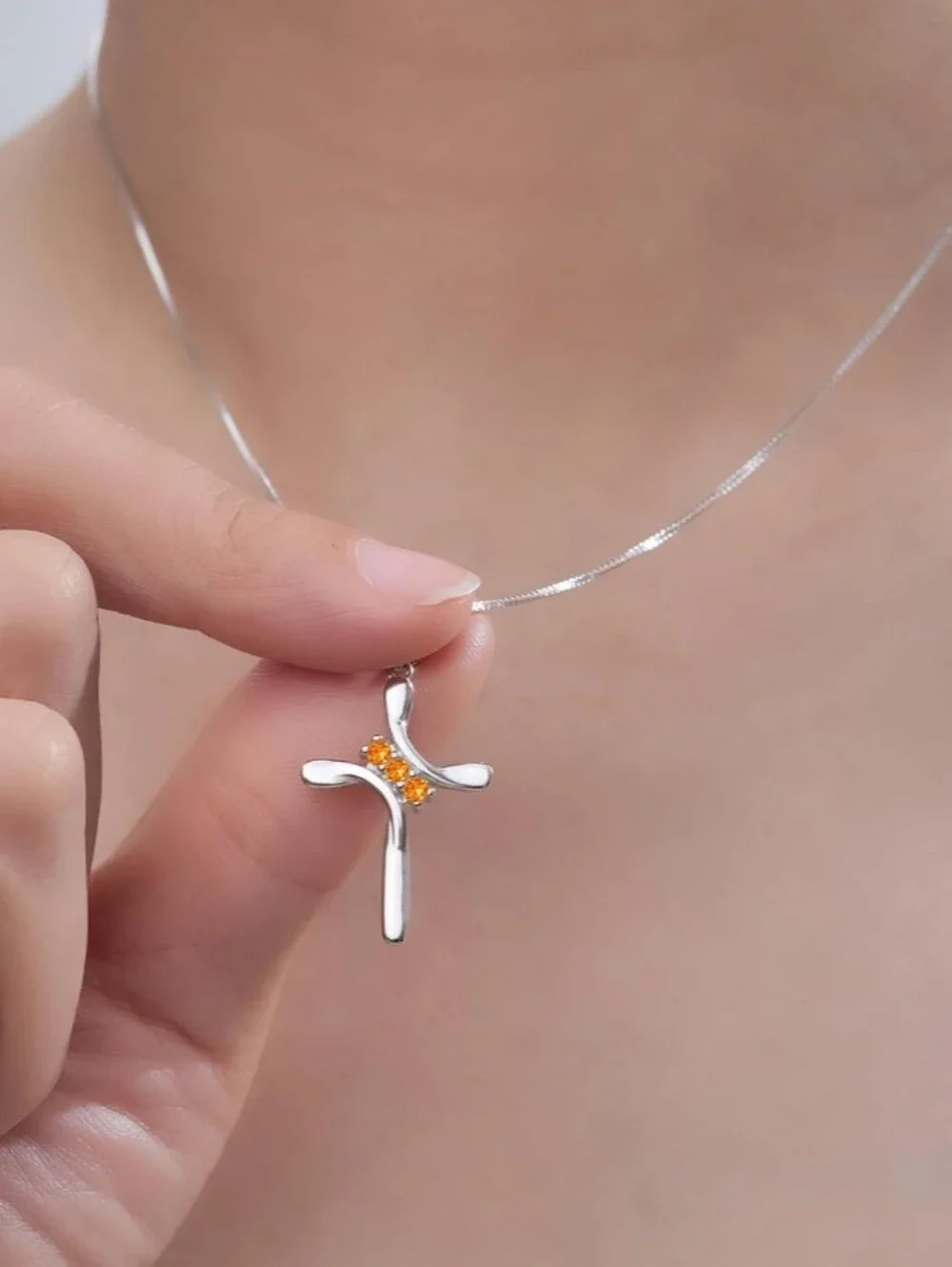 Sterling Silver Cross Necklace with Orange Gem Accents